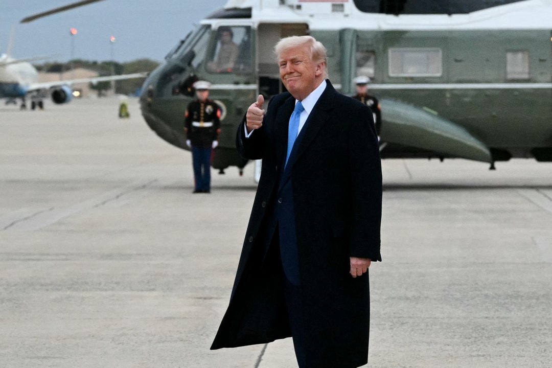 Donald Trump gives a thumbs up after stepping off Air Force One upon arrival at Joint Base Andrews in Maryland on April 6, 2025 | Source: Getty Images