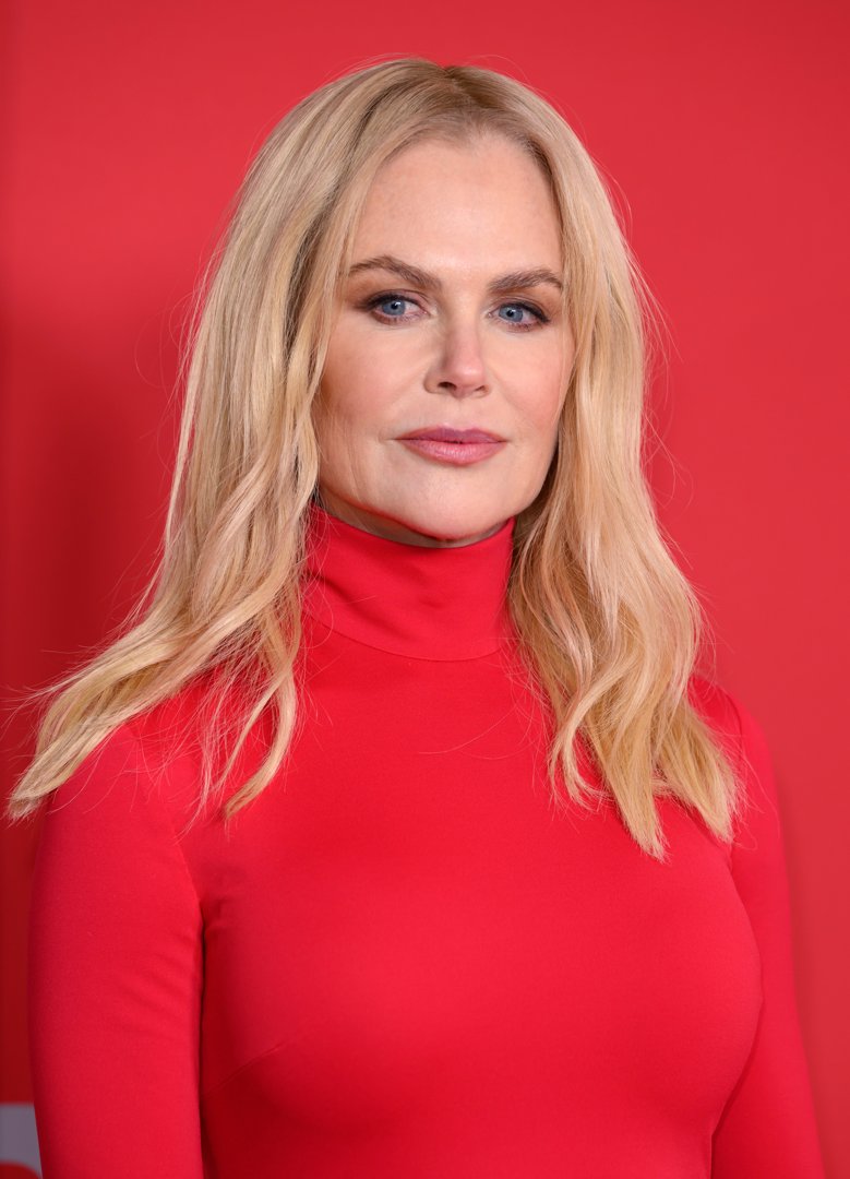 Nicole Kidman attended the GQ Men of the Year Awards 2024 at The Roof Gardens on November 19 in London, England. Her icy blue eyes stood out against a bold red backdrop, framed by long, golden waves parted neatly down the center. With soft contouring and a poised, almost statuesque expression, she projected cool confidence and refined elegance. | Source: Getty Images