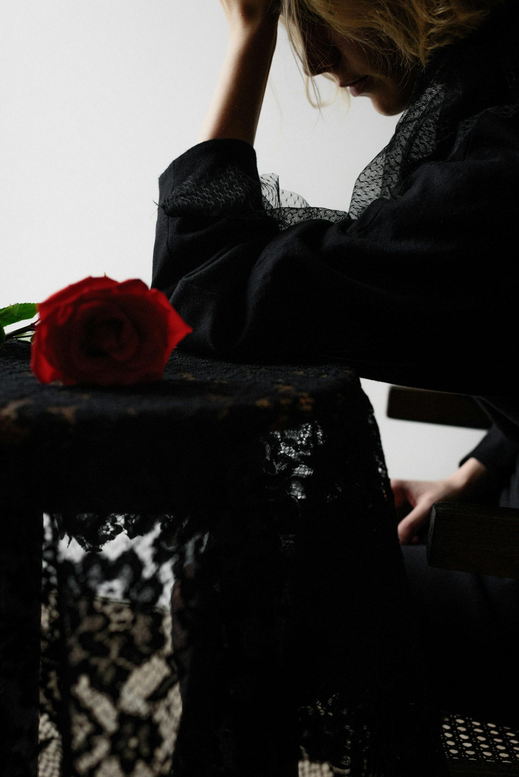 A grieving woman in a black dress | Source: Pexels