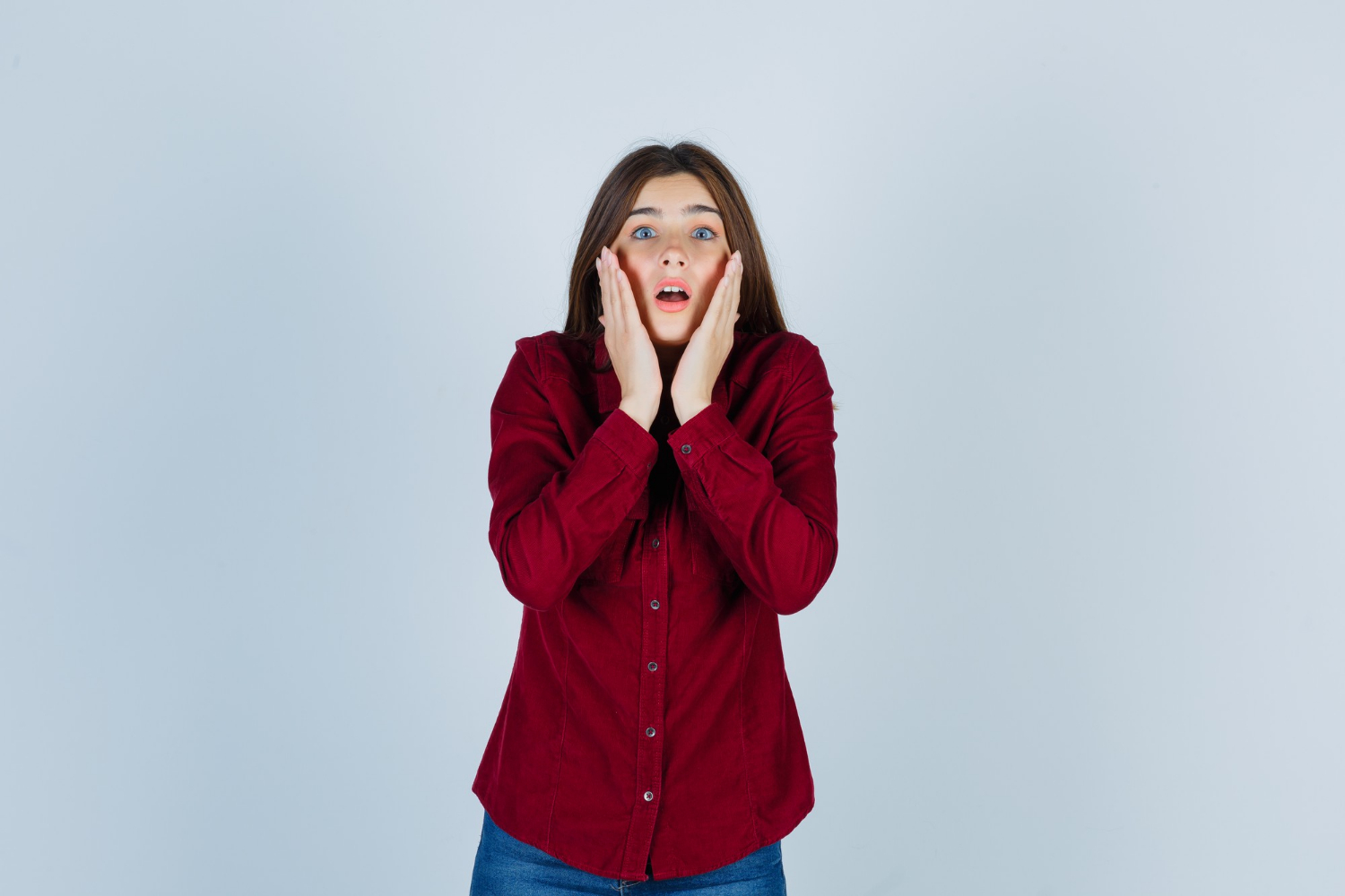 A stunned young woman | Source: Freepik