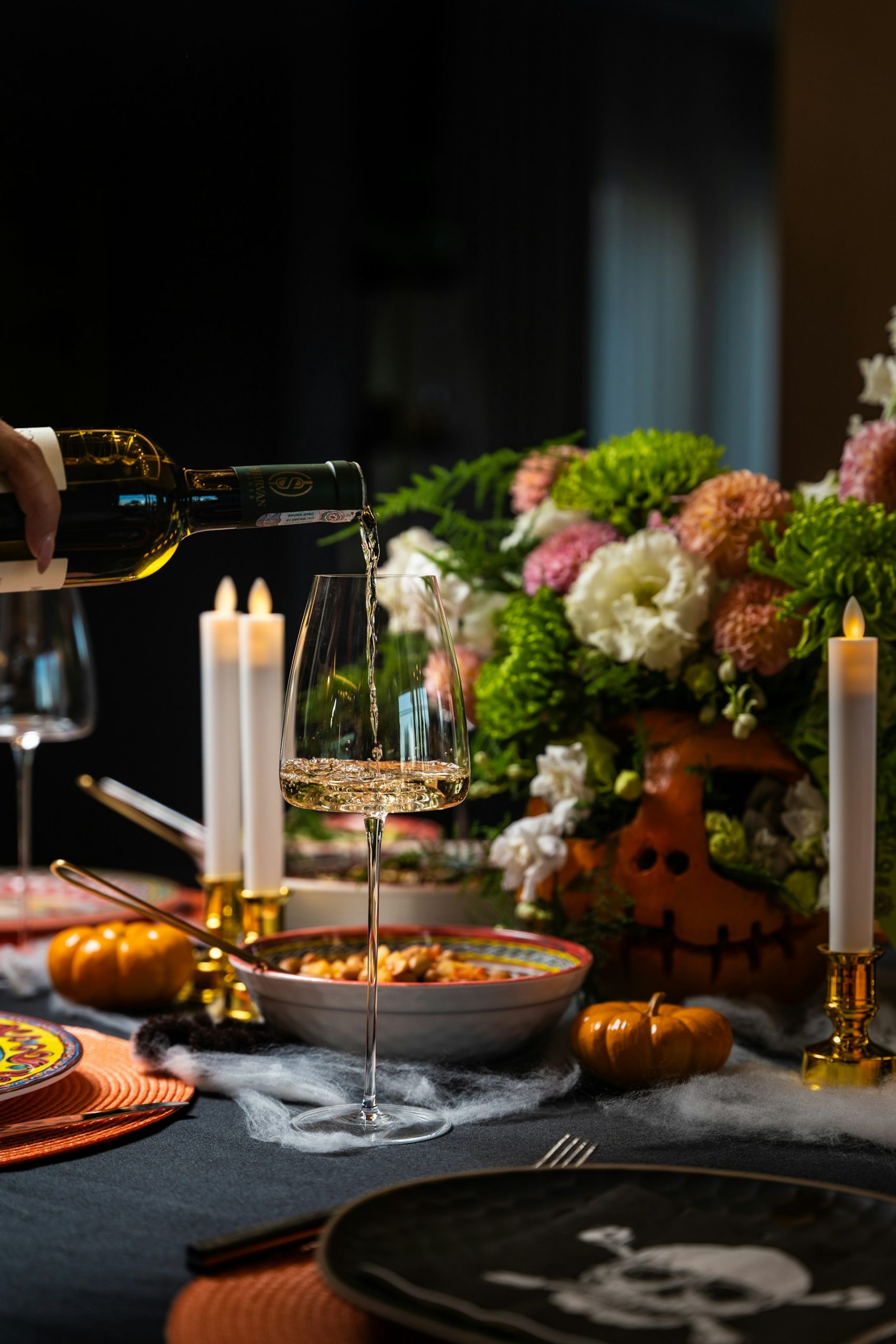 A table set with dinner and drinks | Source: Unsplash