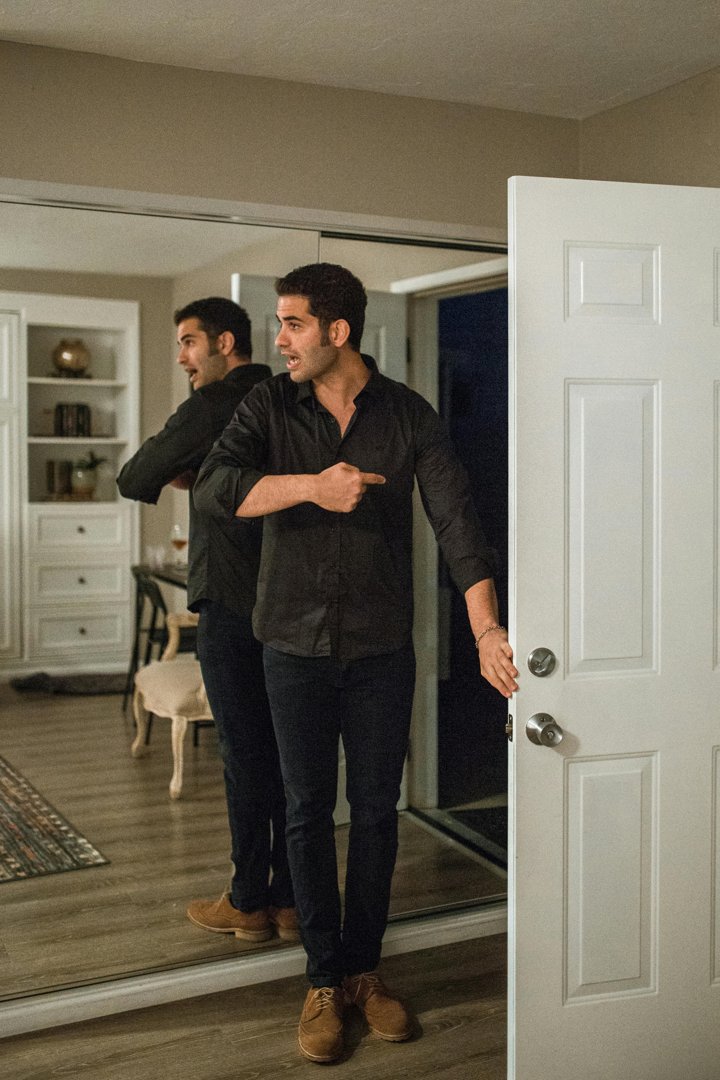 An angry man pointing outside an open door | Source: Pexels