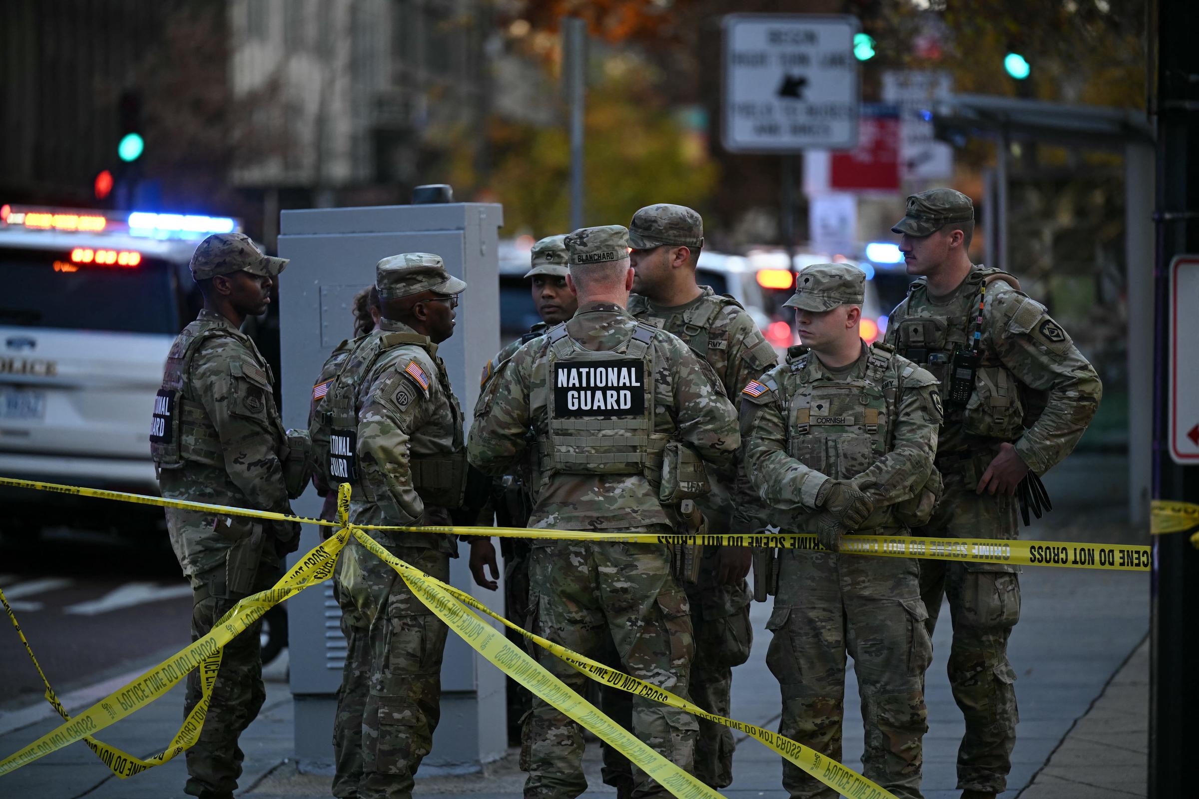 National Guard soldiers stand behind police tape near the scene of a shooting that wounded two service members in the nation’s capital, on November 26, 2025 | Source: Getty Images