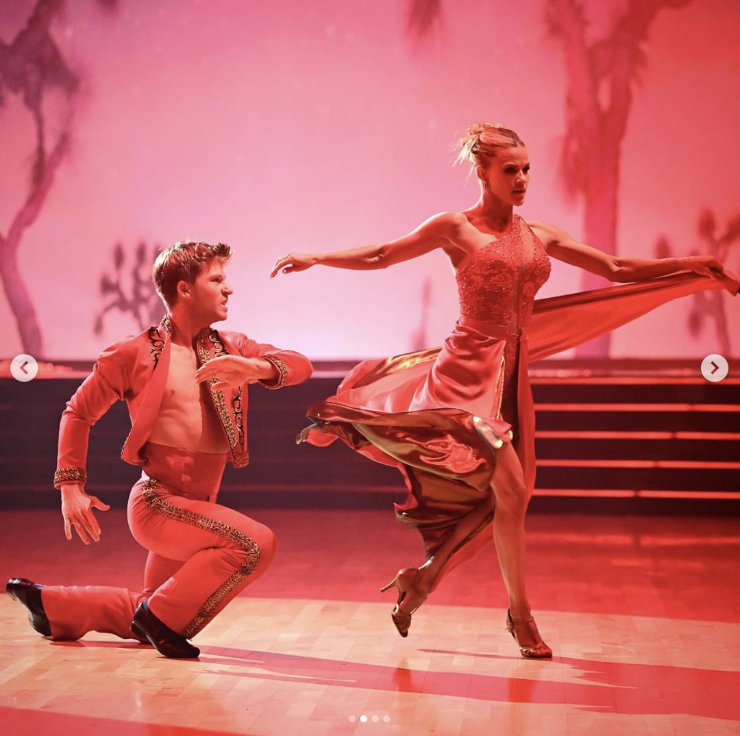 Robert Irwin and Witney Carson are seen performing onstage, in a photo shared on November 4, 2025 | Source: Instagram/dancingwiththestars