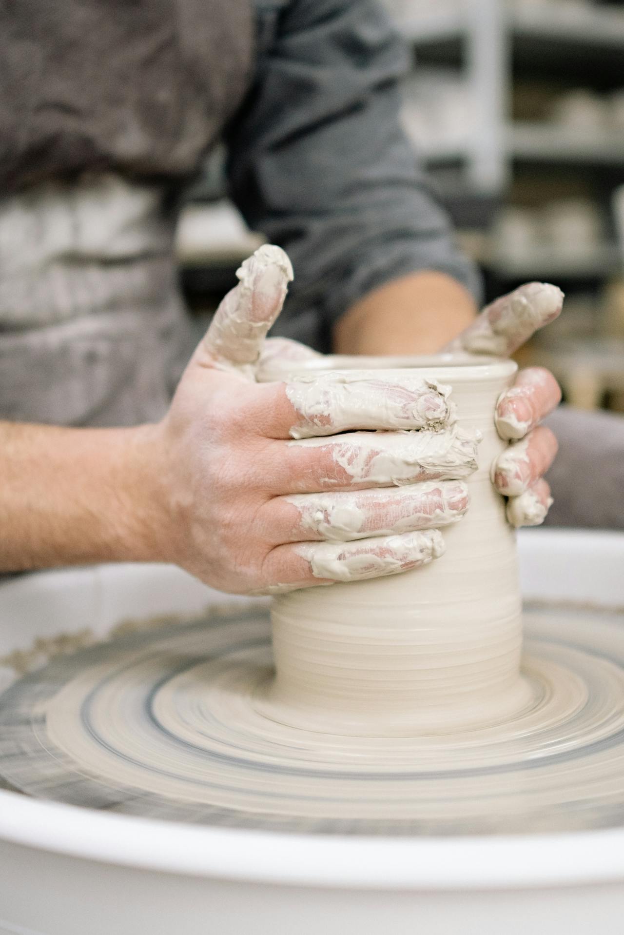 A man making a clay pot | Source: Pexels