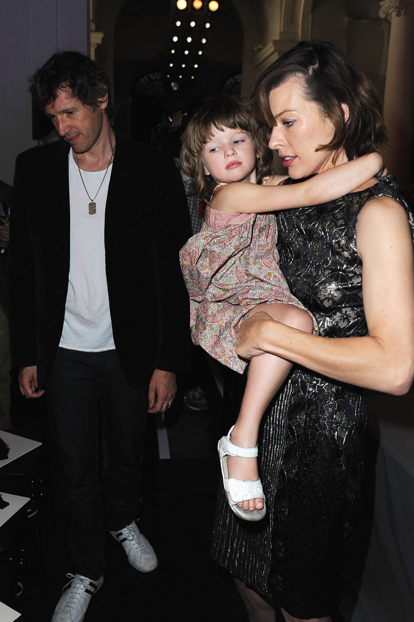 Paul Anderson, 33, Milla Jovovich, 35, and Ever Anderson, 3, attended the Jean Paul Gaultier Haute Couture Fall/Winter 2011/2012 show as part of Paris Fashion Week on July 6, 2011, in France.