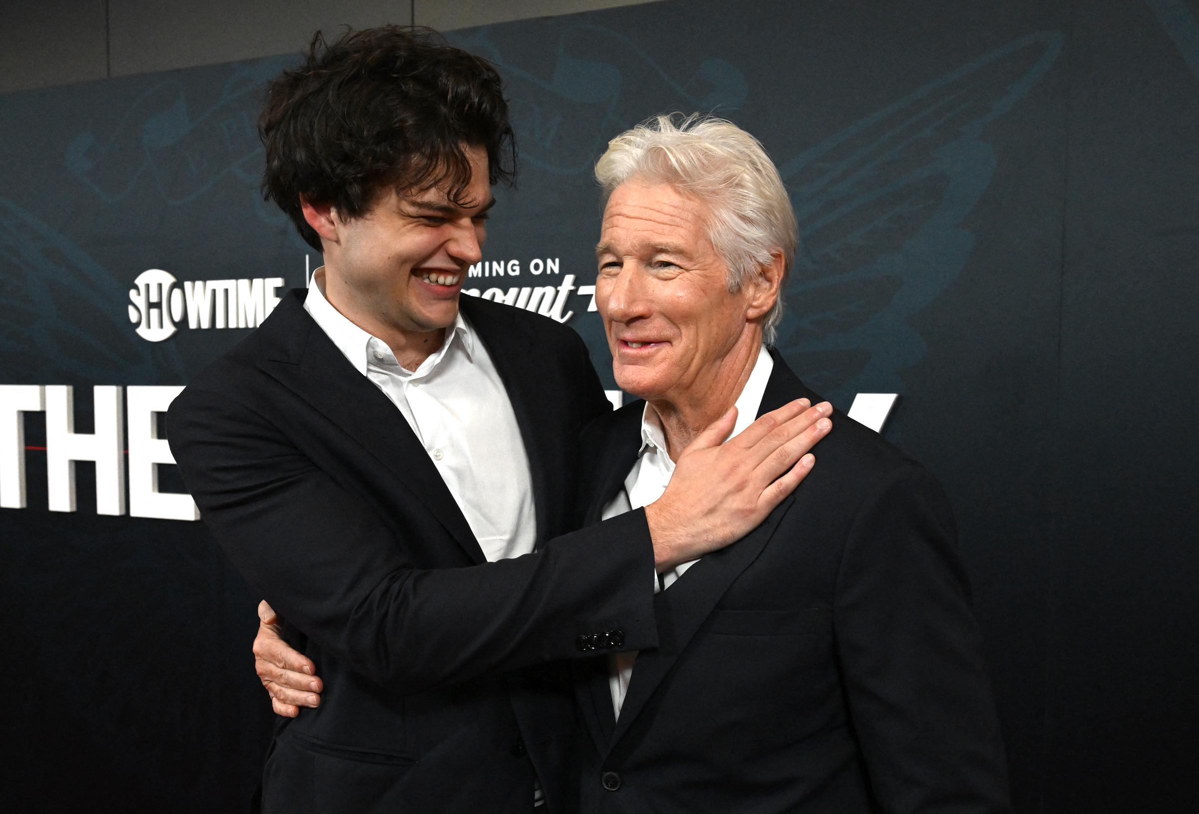 Homer Gere wraps an arm around his dad, Richard Gere, sharing a genuine laugh at 