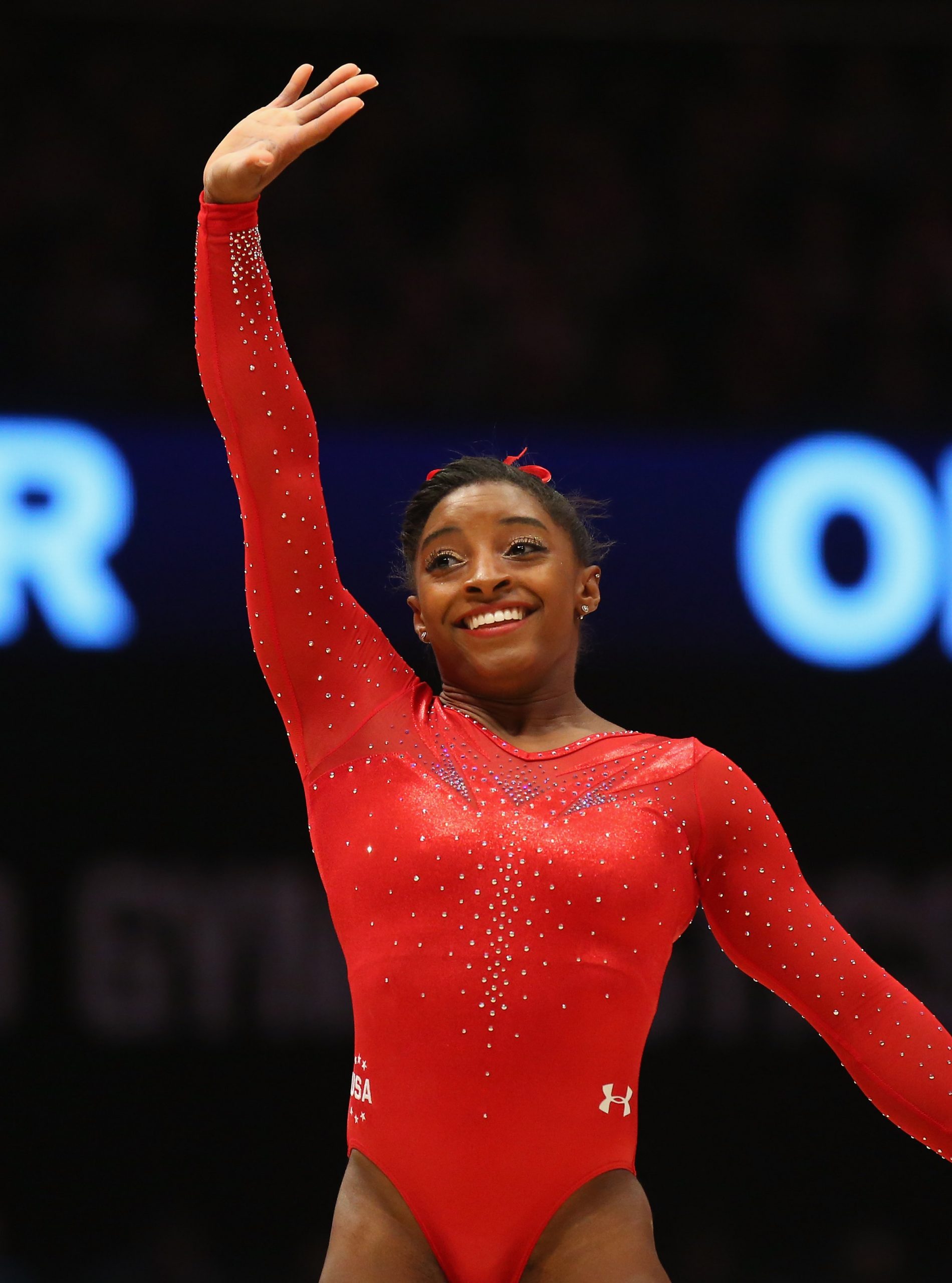 Biles flashes a victorious smile as she waves to the audience after her floor routine in the All-Around Final at the 2015 World Artistic Gymnastics Championships on October 29 in Glasgow, Scotland. The 18-year-old dazzled once again, cementing her growing dominance on the world stage.