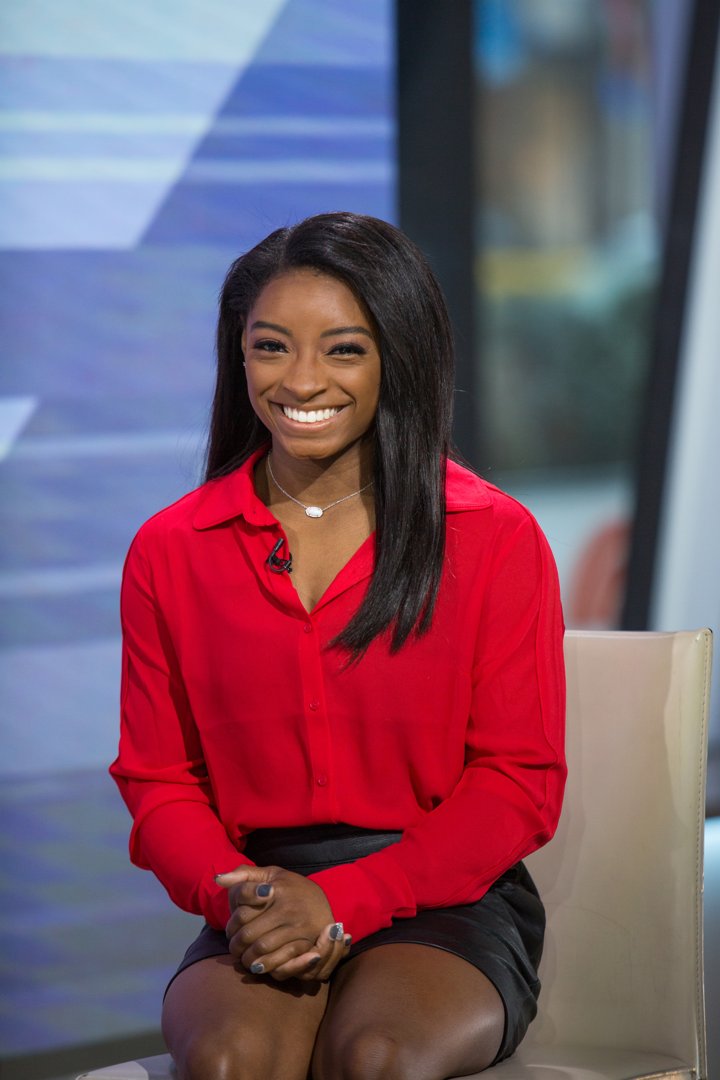 Biles beams during a live appearance on the 