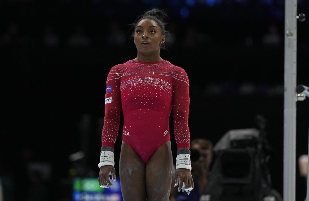Biles prepares to compete on the uneven bars during the 2023 FIG Artistic Gymnastics World Championships at Antwerp Sportpaleis on October 7, in Antwerp, Belgium. With chalked hands and laser focus, the American powerhouse continued her stunning comeback on the global stage.