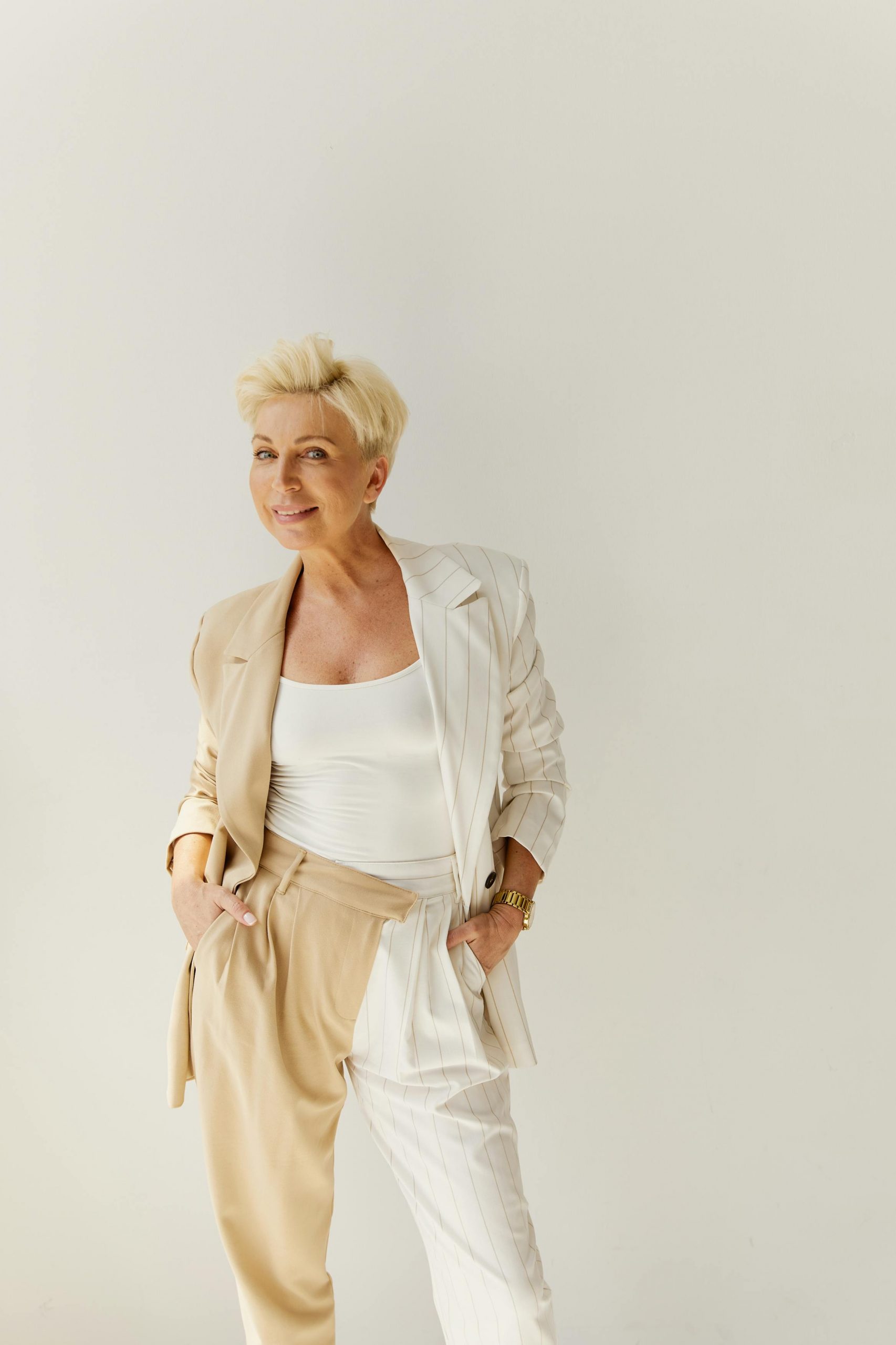 A woman smiling awkwardly | Source: Pexels