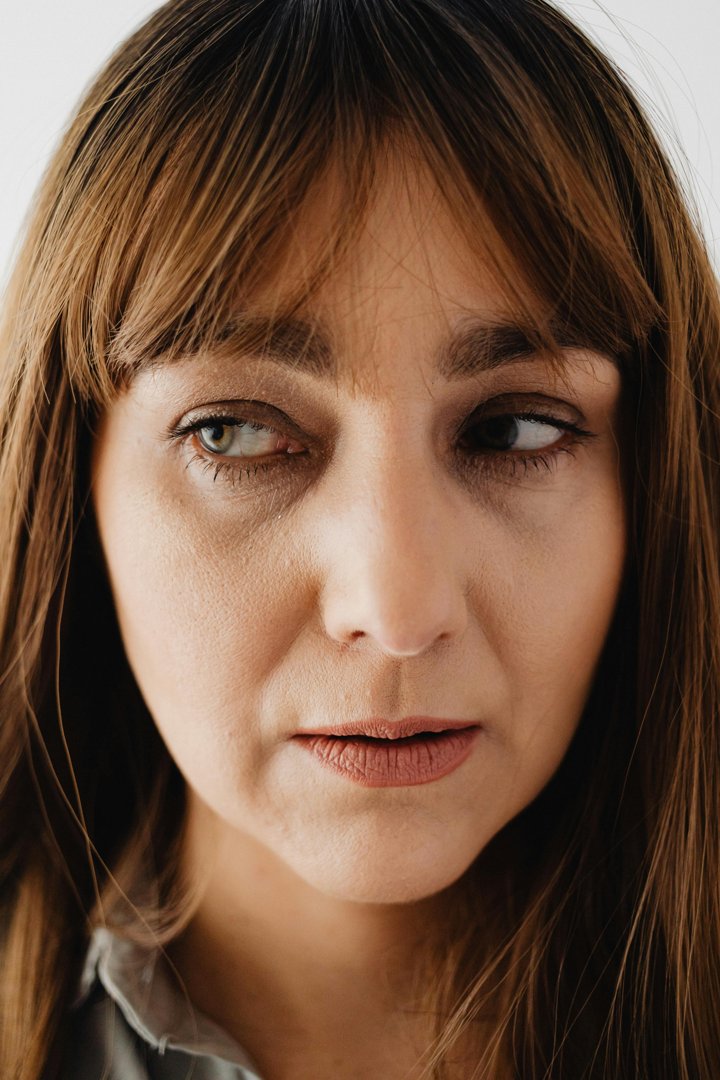 An unhappy woman looking to the side | Source: Pexels