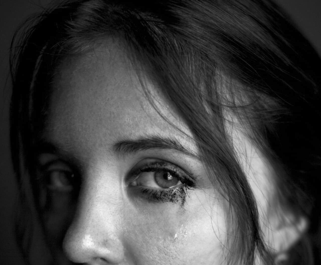 Grayscale shot of a teary-eyed woman | Source: Pexels
