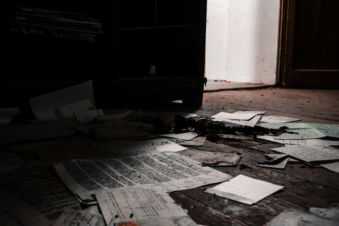 Scattered papers on a floor | Source: Unsplash