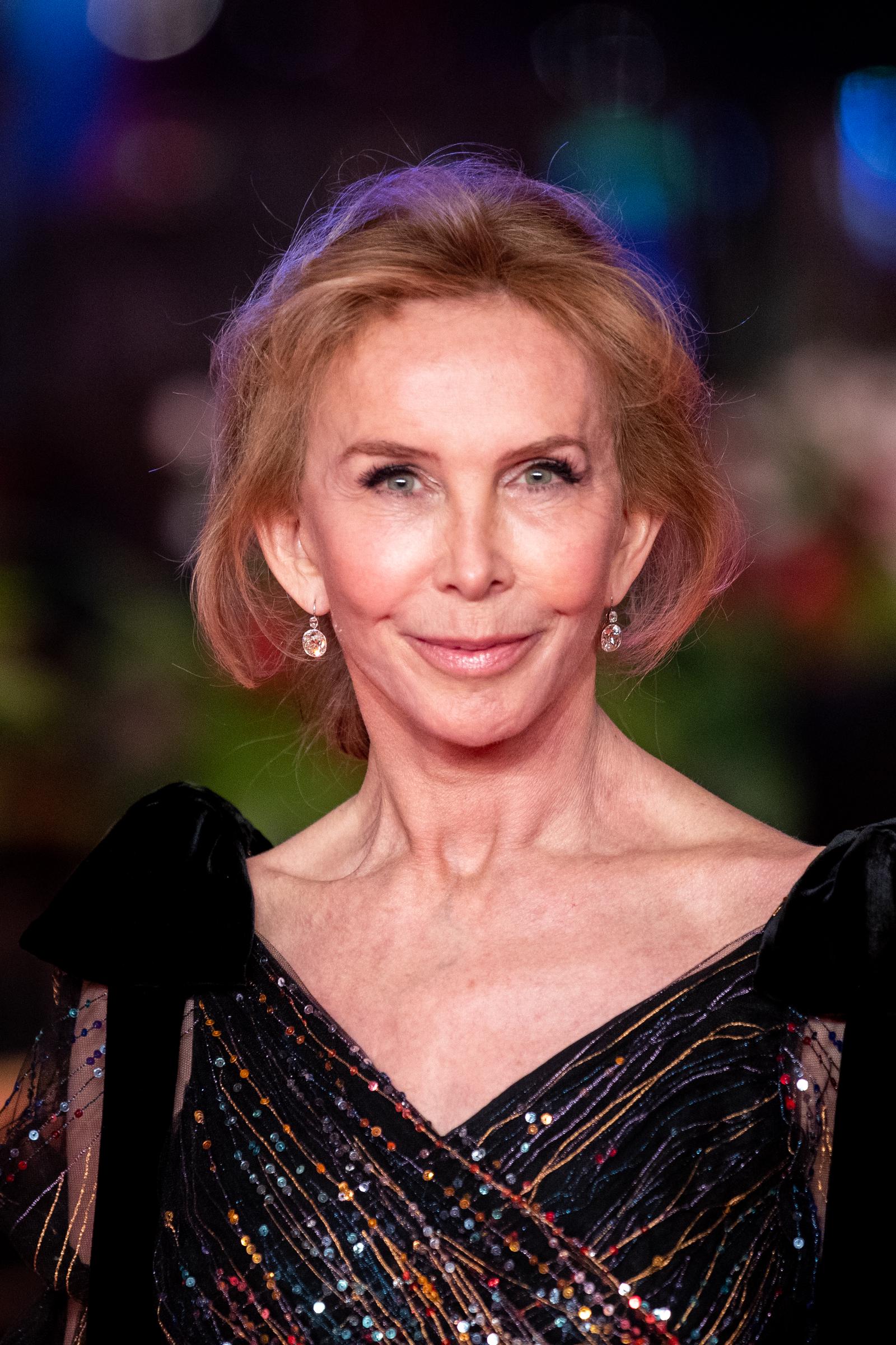 Trudie Styler, at 65, was captured with a smooth, high-tension complexion, her sculpted cheekbones accentuating a subtle, closed-lip smile, and dramatically arched eyebrows, while arriving for the closing ceremony of the 69th Berlinale International Film Festival on February 16, 2019, in Berlin, Germany.
