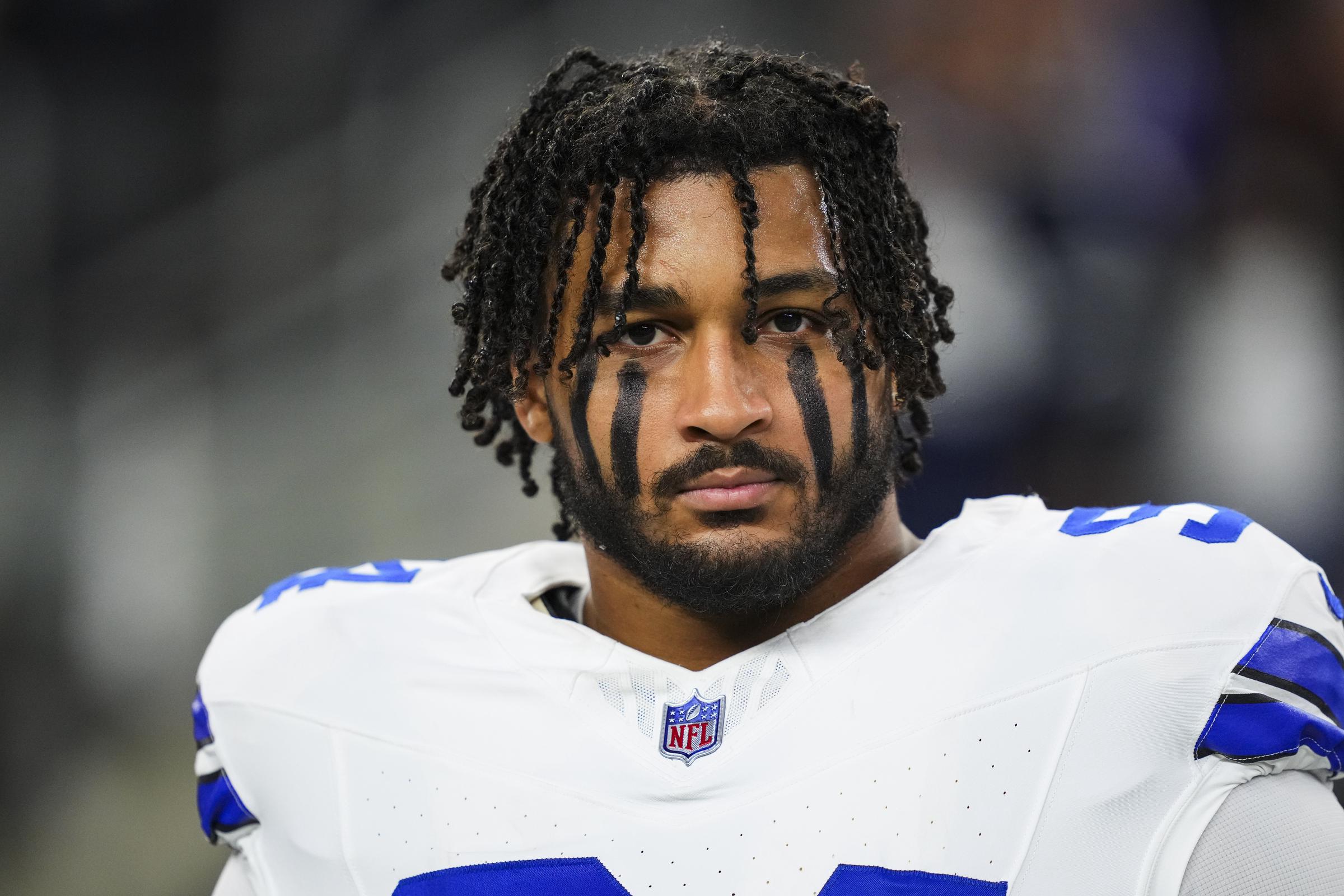 Marshawn Kneeland stands on the sideline during the national anthem before an NFL game against the Tampa Bay Buccaneers in Arlington, Texas on December 22, 2024 | Source: Getty Images
