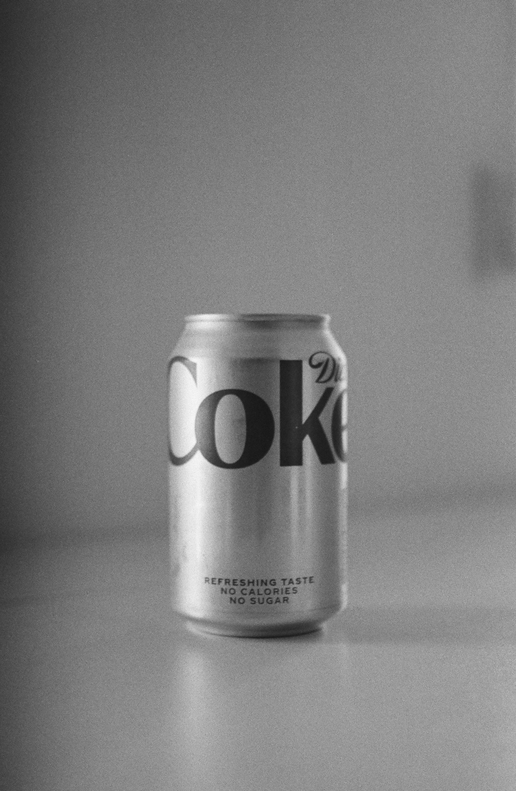 Grayscale photo of a diet can of coke | Source: Pexels