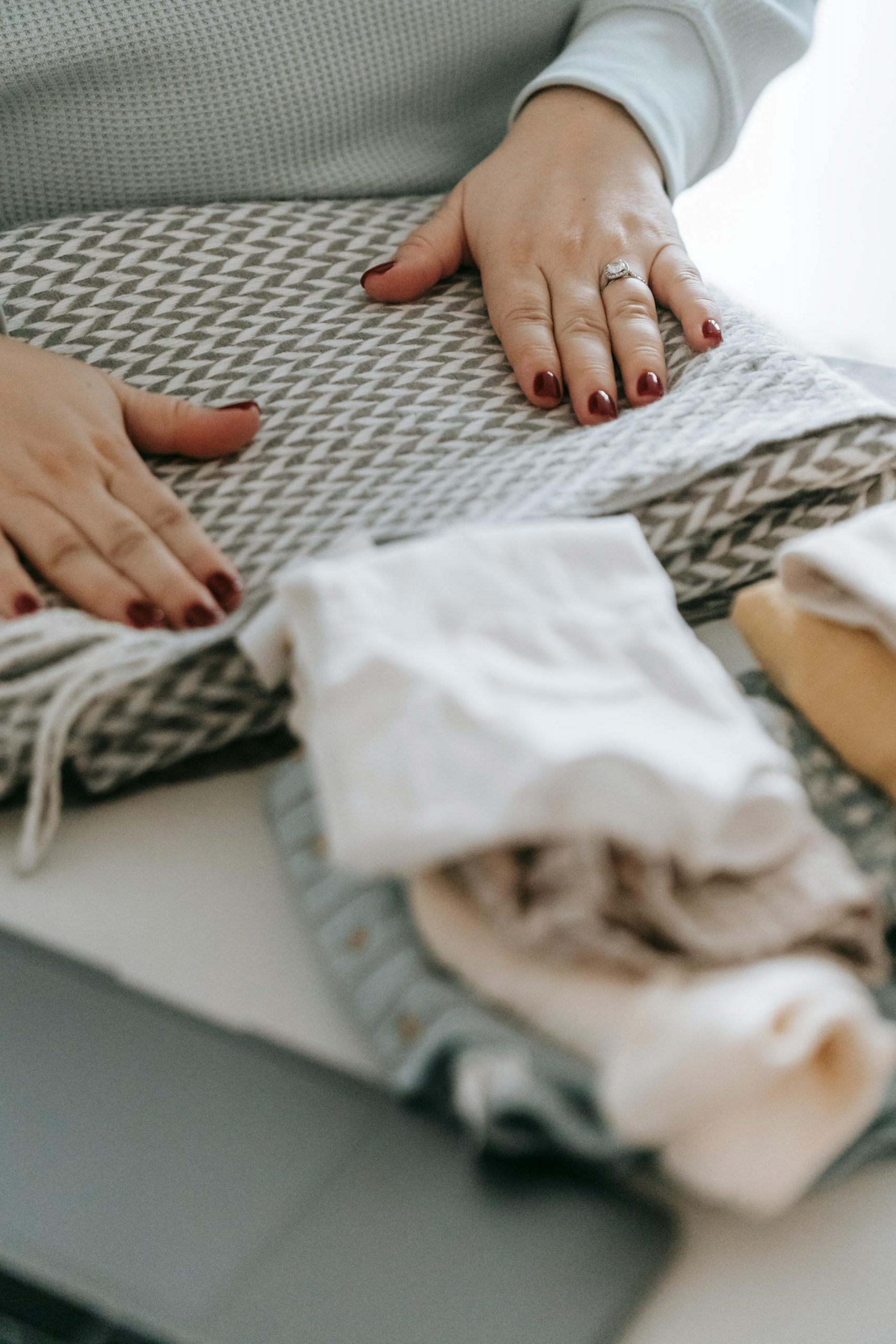 A close-up shot of a woman folding laundry | Source: Pexels