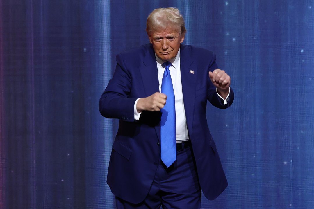 President Donald Trump dances after delivering remarks at an award ceremony where he was honored as a recipient, on December 5, 2024 | Source: Getty Images