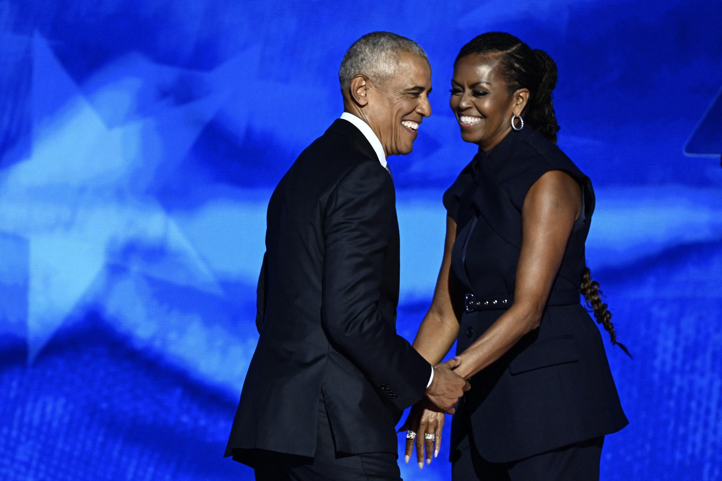 Barack and Michelle Obama on the second day of the Democratic National Convention on August 20, 2024, in Chicago, Illinois. | Source: Getty Images