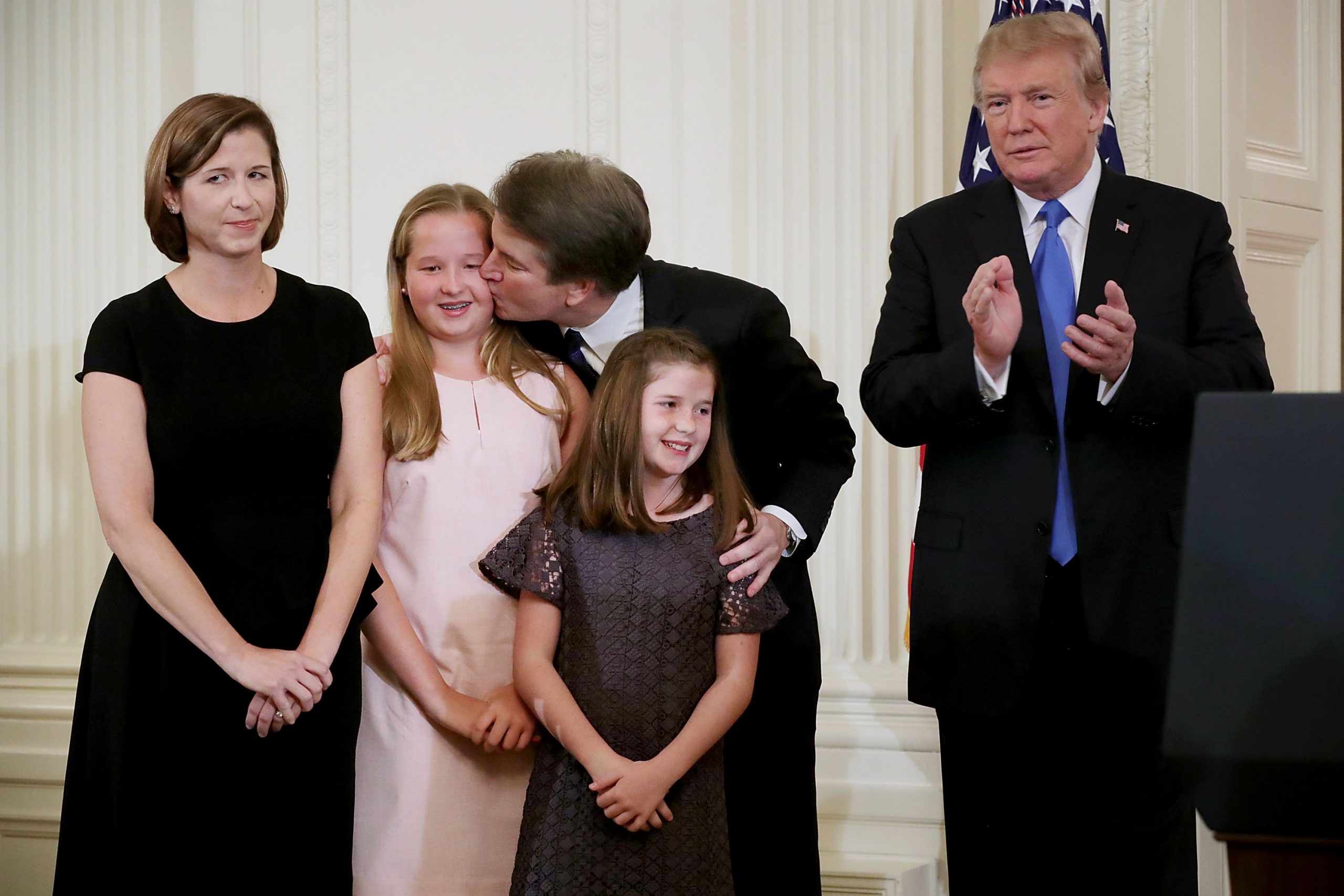 Ashley and Judge Brett Kavanaugh with their children and Donald Trump in the East Room of the White House July 9, 2018, in Washington, D.C. | Source: Getty Images