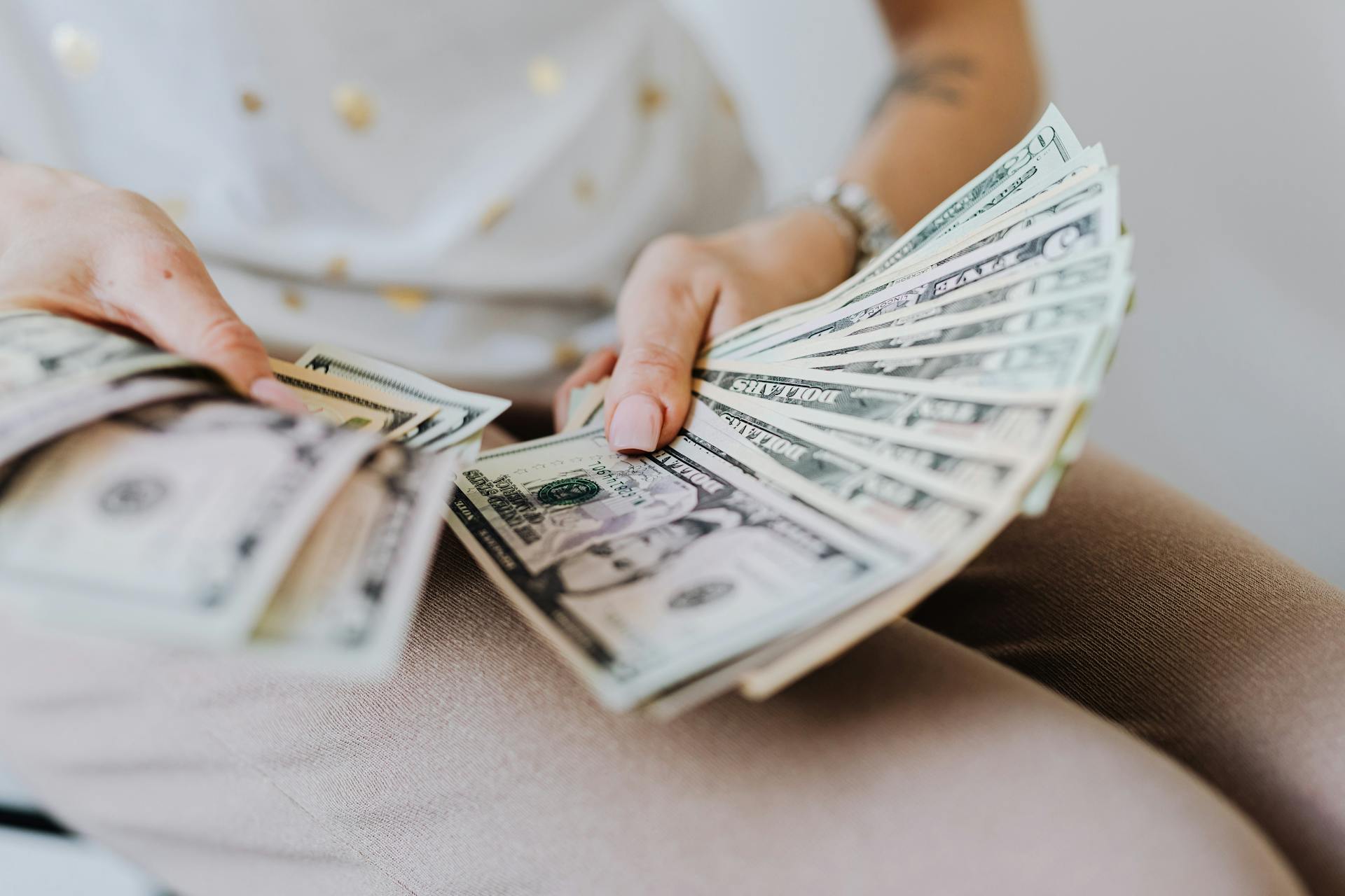 A woman holding money | Source: Pexels