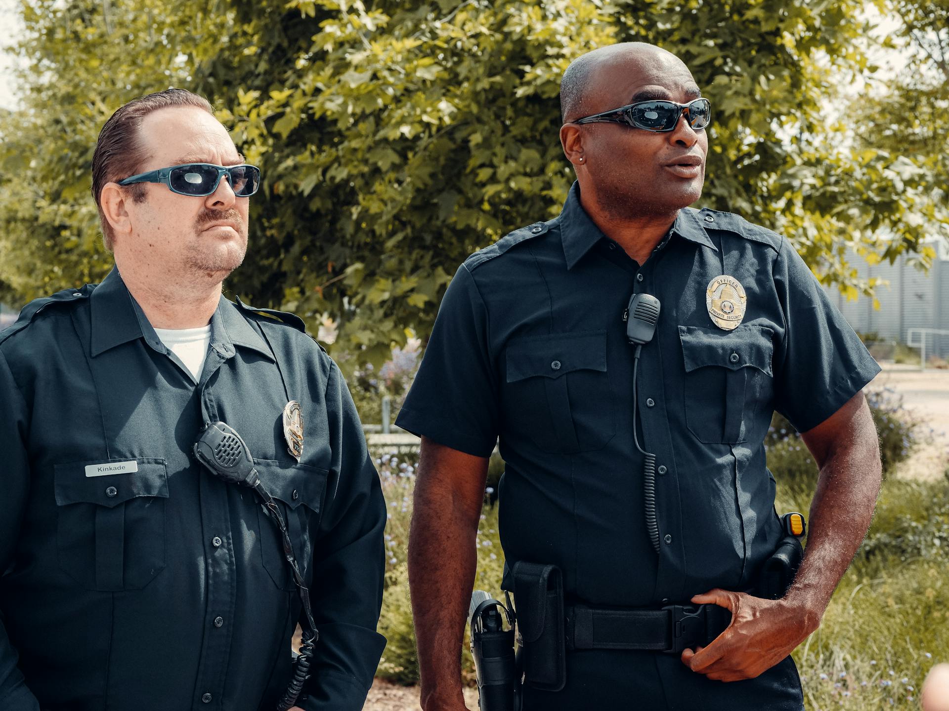 Two police officers outside a house | Source: Pexels