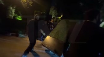 The faux hedges for Kris Jenner's 70th birthday party being moved out of the street. | Source: Instagram/tmz_tv