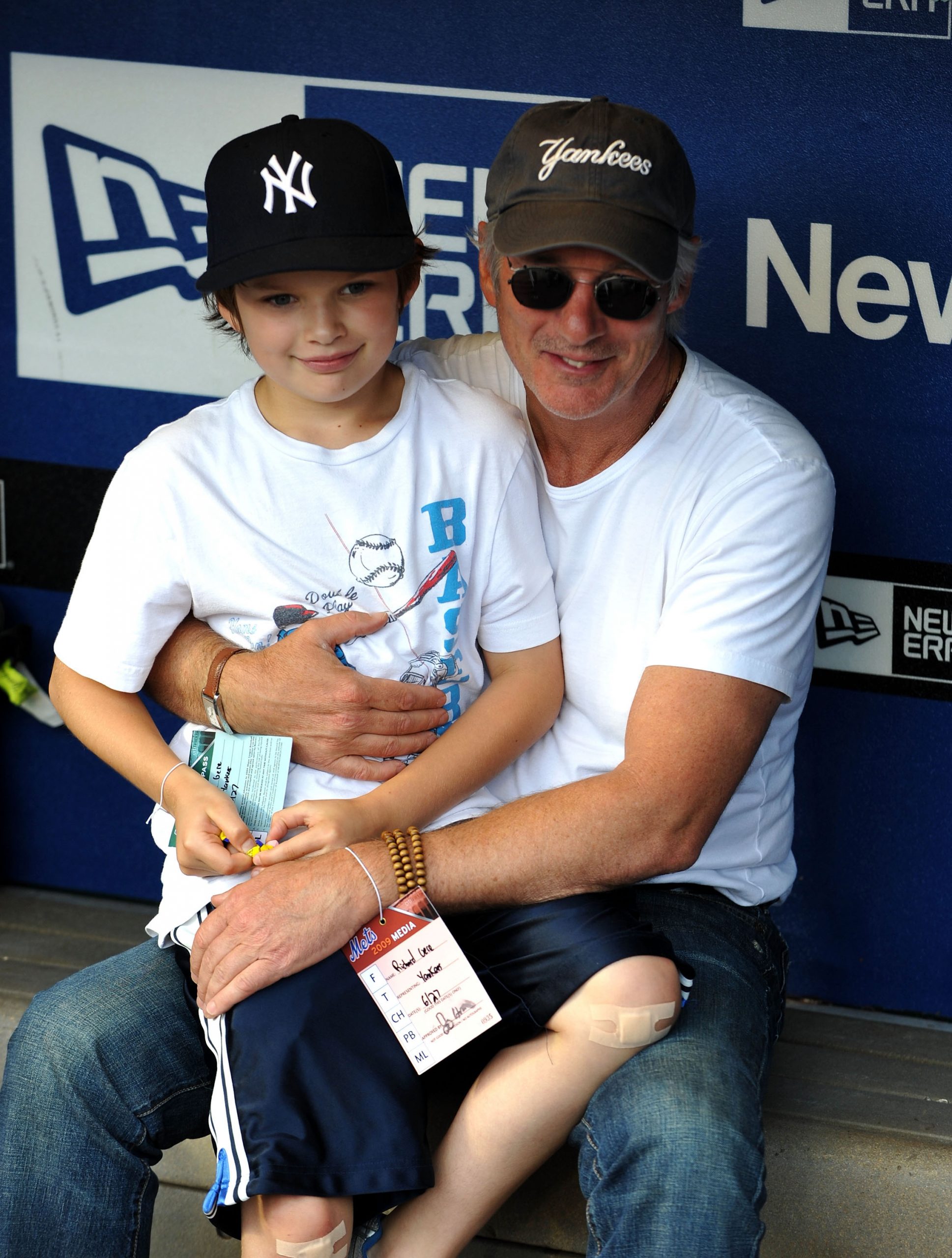 In the dugout at Citi Field in Queens, New York, Richard Gere wraps an arm around Homer Gere as they gear up to watch the Subway Series between the New York Yankees and the New York Mets.