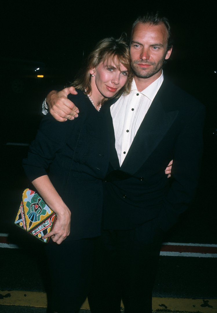 Trudie Styler, at 36, showed a slender face with pronounced jaw definition, an intense gaze from her large eyes, and her hair parted with bangs falling softly over her forehead, while attending the 5th Annual Rock and Roll Hall of Fame Induction Ceremony with Sting on January 17, 1990, at the Waldorf-Astoria in New York.