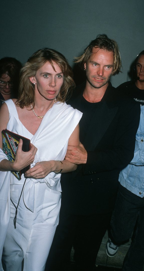 Trudie Styler, at 36, displayed a narrow facial structure with a long, defined nose bridge, a light application of makeup emphasizing her lips and brow, and soft, shoulder-length hair, while attending the All Star Jam Night with Sting on February 12, 1990, in Los Angeles, California.