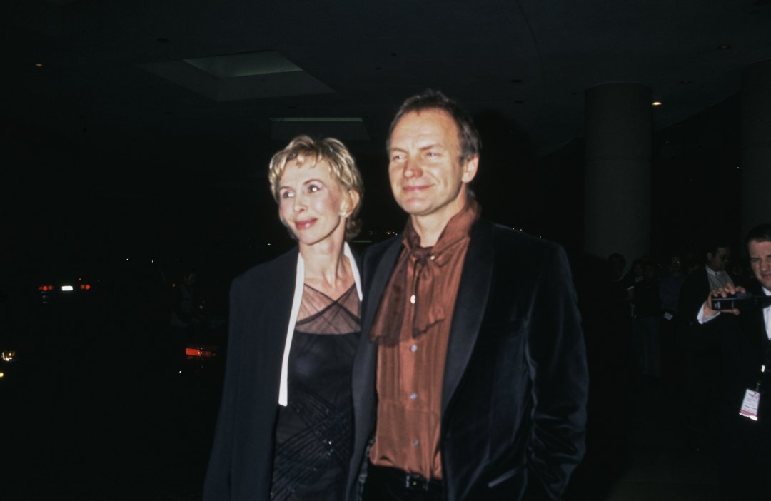 Trudie Styler, at 45, exhibited a gentle, knowing expression with a slight upturn to her mouth and smooth skin beneath short, casually styled blonde hair, while attending the American Film Institute's Tribute to Dustin Hoffman with Sting on February 18, 1999, in Los Angeles, California.