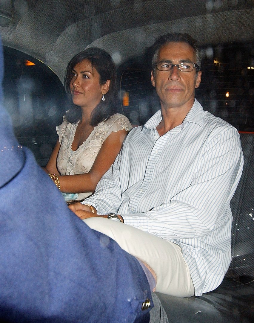 Natasha Caine and an unidentified man are seen leaving Cipriani restaurant in London on September 1, 2005. Natasha smiles slightly as she looks ahead in the car, while her companion appears distracted by something off to the side.