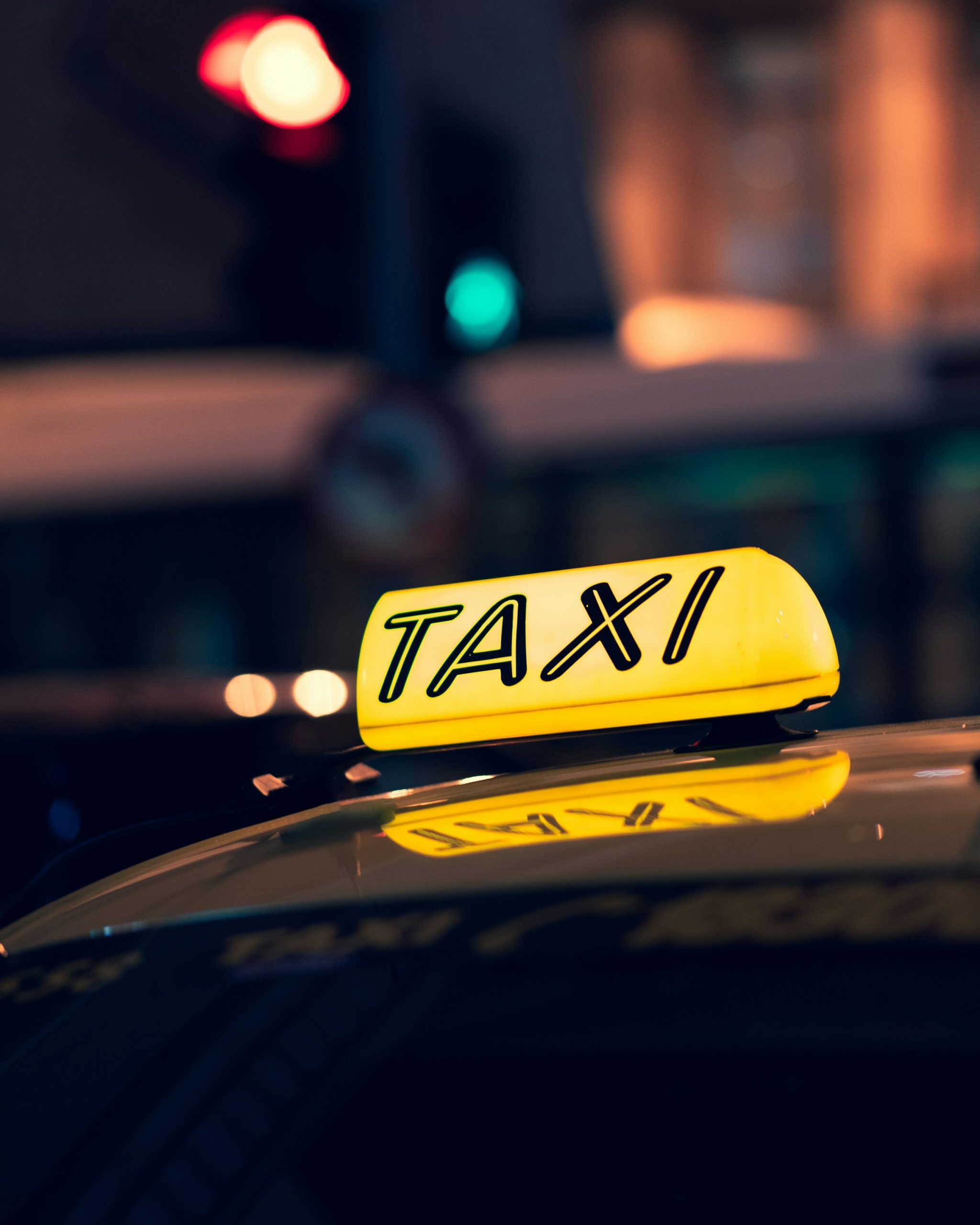 Close-up shot of a cab on the road during nighttime | Source: Unsplash