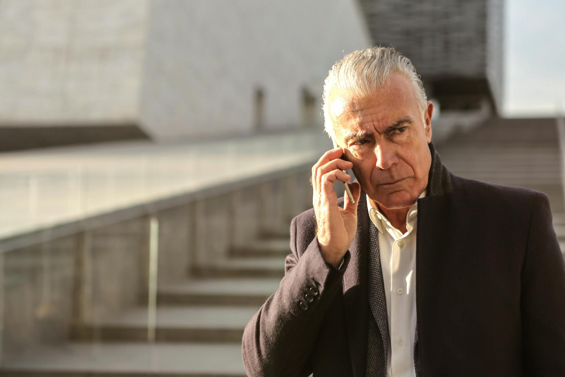 A distressed senior man talking on the phone | Source: Pexels
