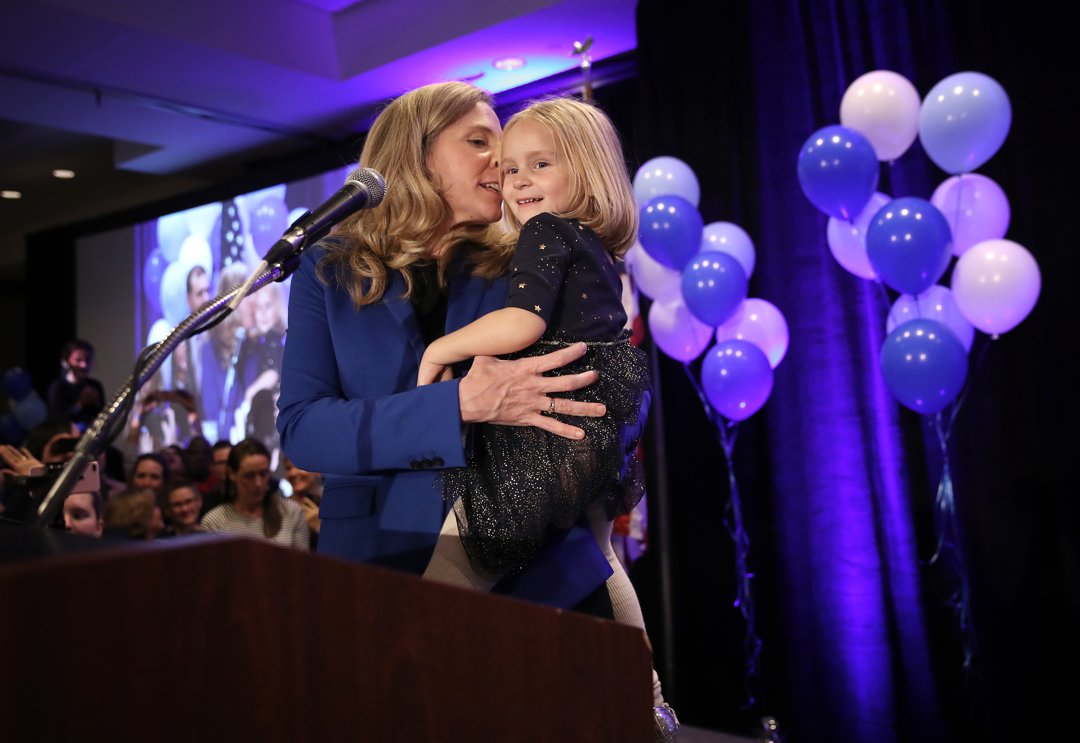 Abigail Spanberger holds her daughter Catherine as she thanks supporters at an election night rally on November 6, 2018, in Richmond, Virginia | Source: Getty Images