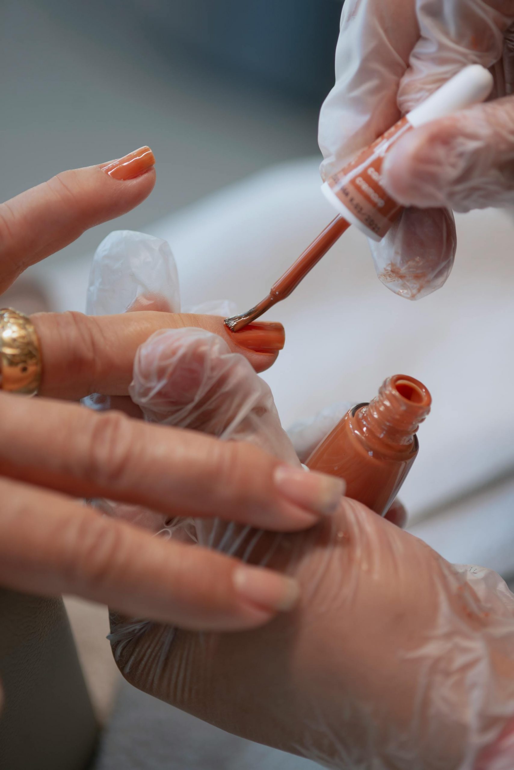 A woman applying nail polish | Source: Pexels