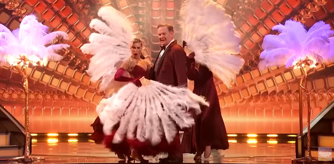 Andy Richter and Emma Slater exude Old-Hollywood glamor, as seen from a video post dated November 12, 2025. | Source: YouTube/ DancingWithTheStars