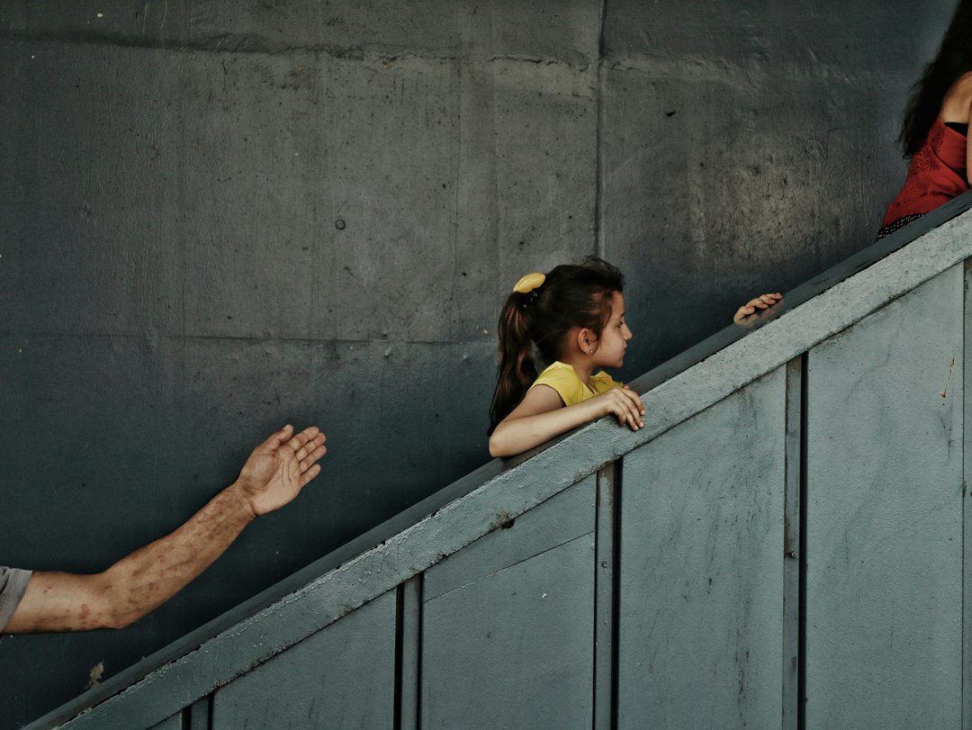 Children being led upstairs | Source: Pexels