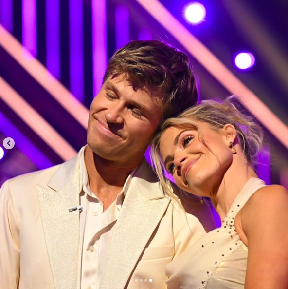 Robert Irwin and Witney Carson sharing a moment while smiling on stage, posted on November 12, 2025. | Source: Instagram/dancingwiththestars