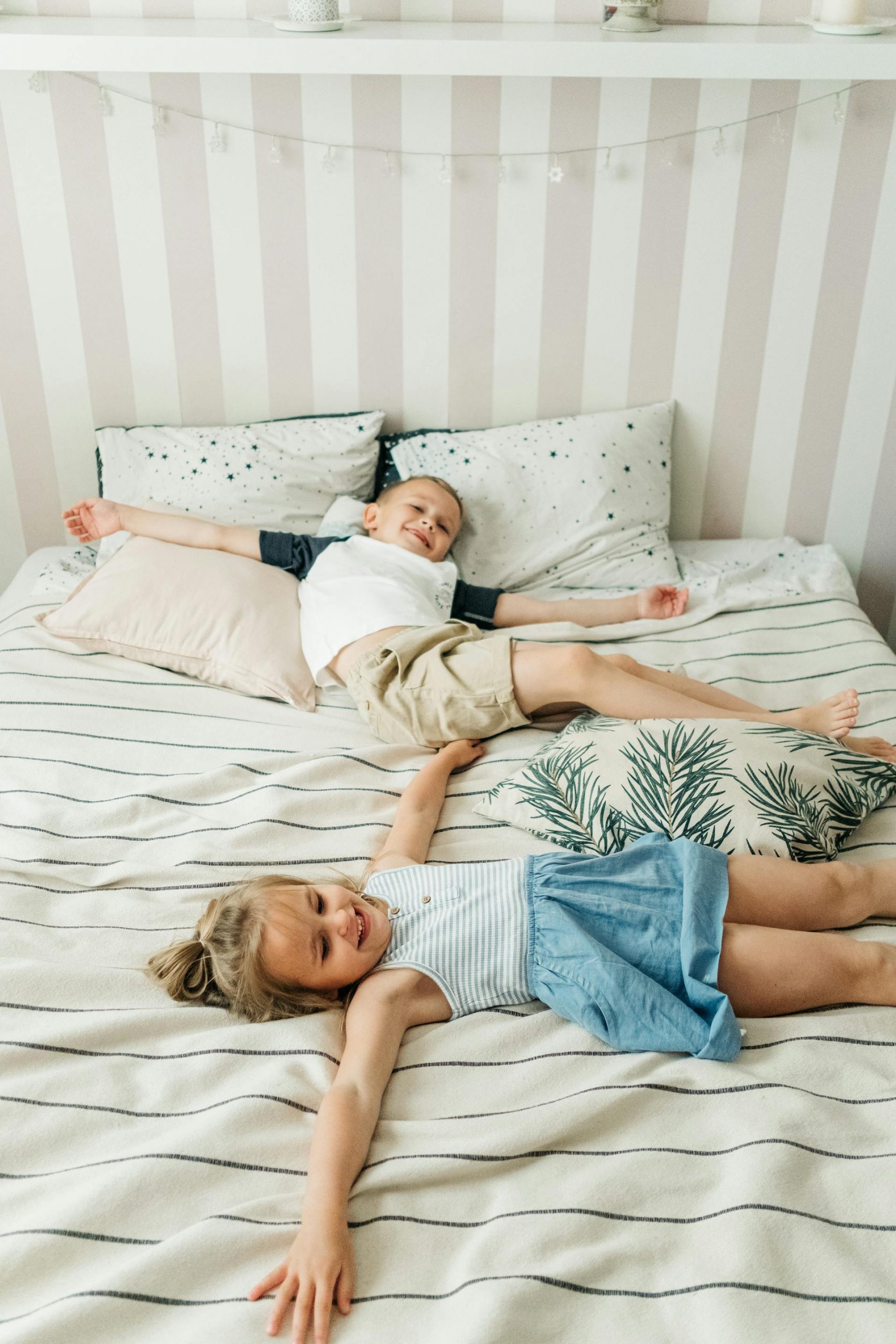 Kids lying on the bed | Source: Pexels