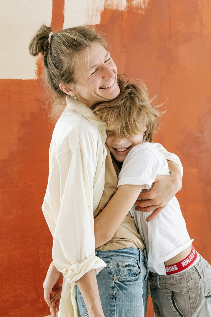 A happy boy hugging his mother | Source: Pexels