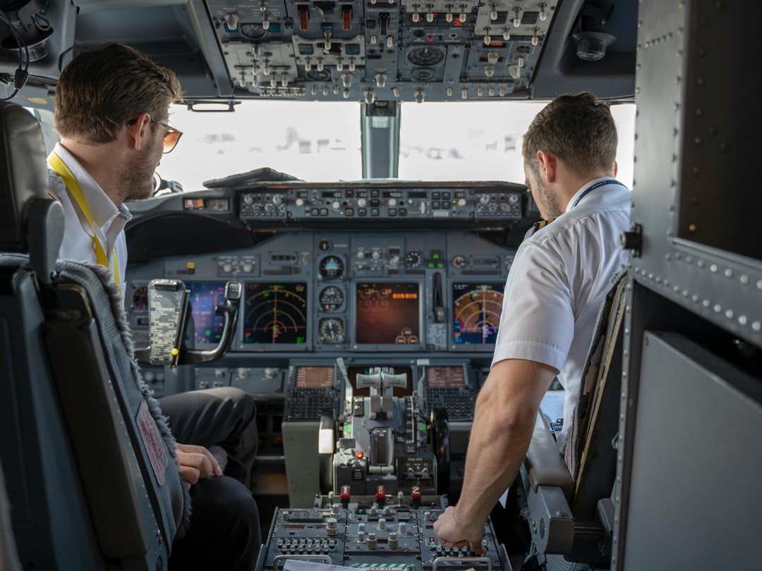 Captains sitting in a cockpit | Source: Pexels