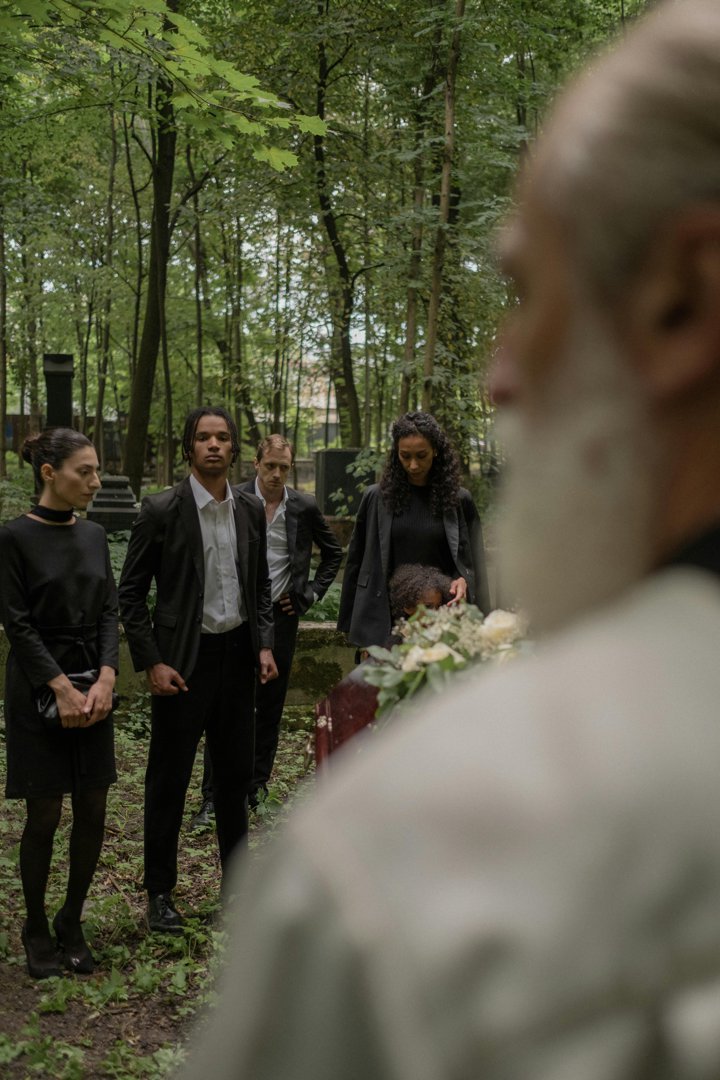 People standing in a cemetery | Source: Pexels