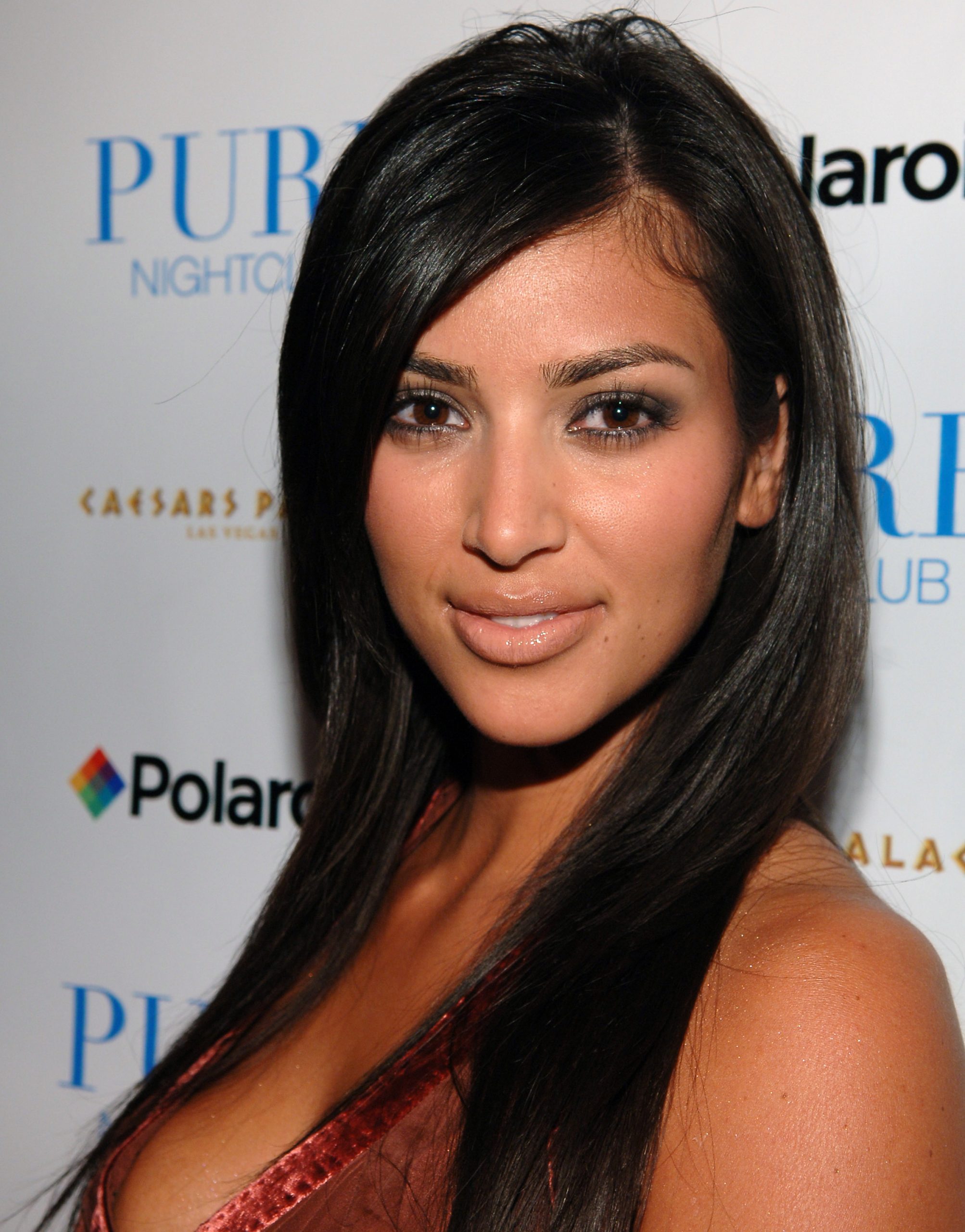 Kim Kardashian, 25, presented a full, rounded facial structure, featuring a prominent nose bridge, naturally full cheeks, and a soft jawline, while attending the Matt Leinart Draft Party at Pure Nightclub on May 2, 2006, in Las Vegas, Nevada.