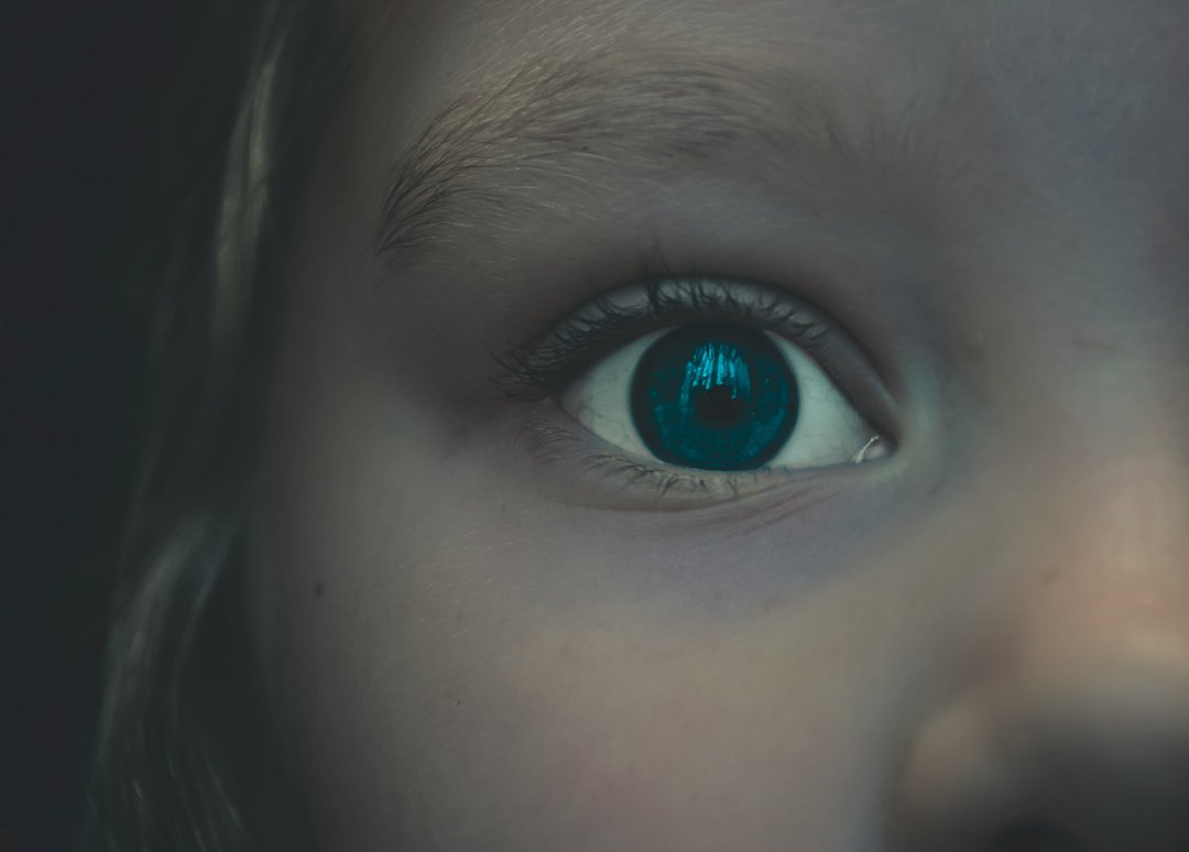 A close-up of a child's fearful face | Source: Unsplash