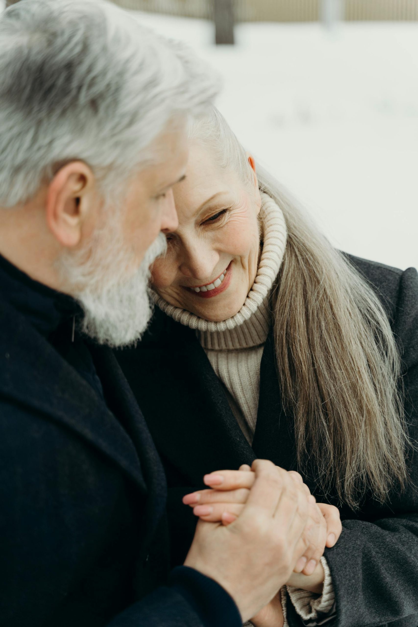 A senior couple sharing a hug | Source: Pexels