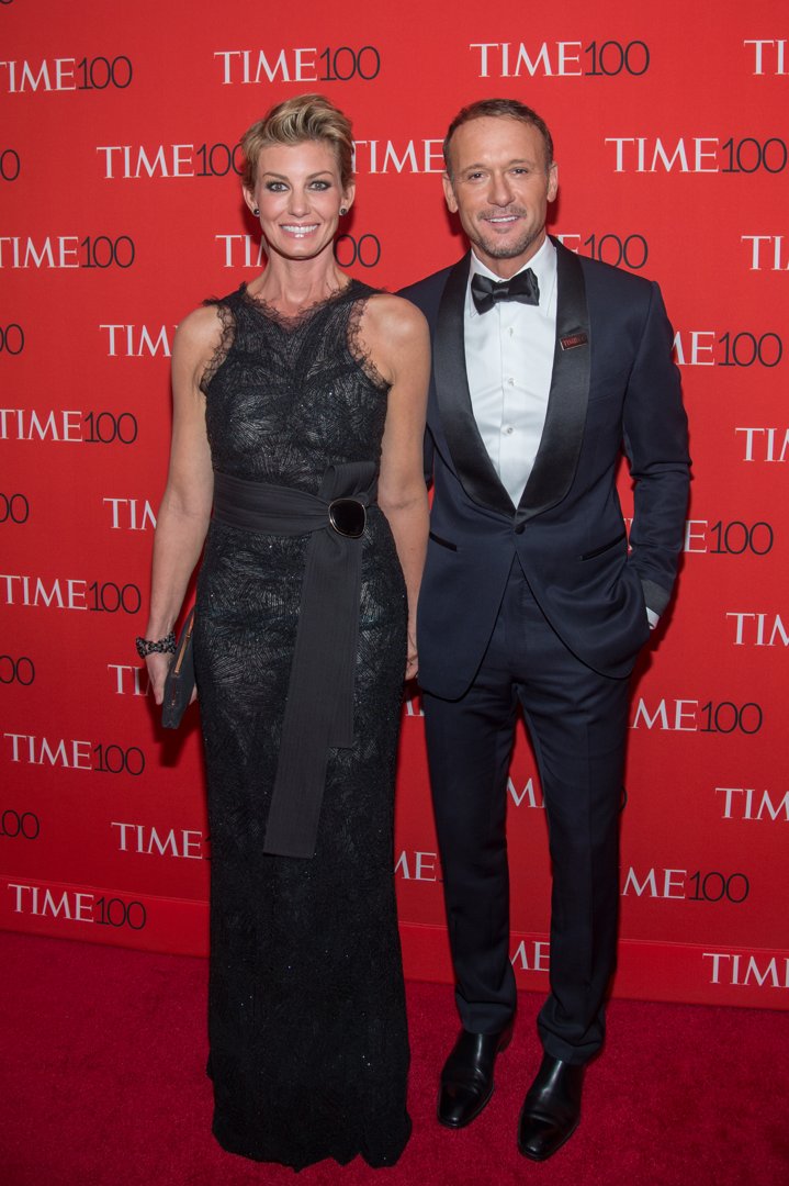 On the red carpet at the Time 100 Gala, Faith Hill stuns in a dramatic black gown while Tim McGraw keeps it classic in a tux. Their upright pose is polished, with just enough warmth to show their unshakable bond.