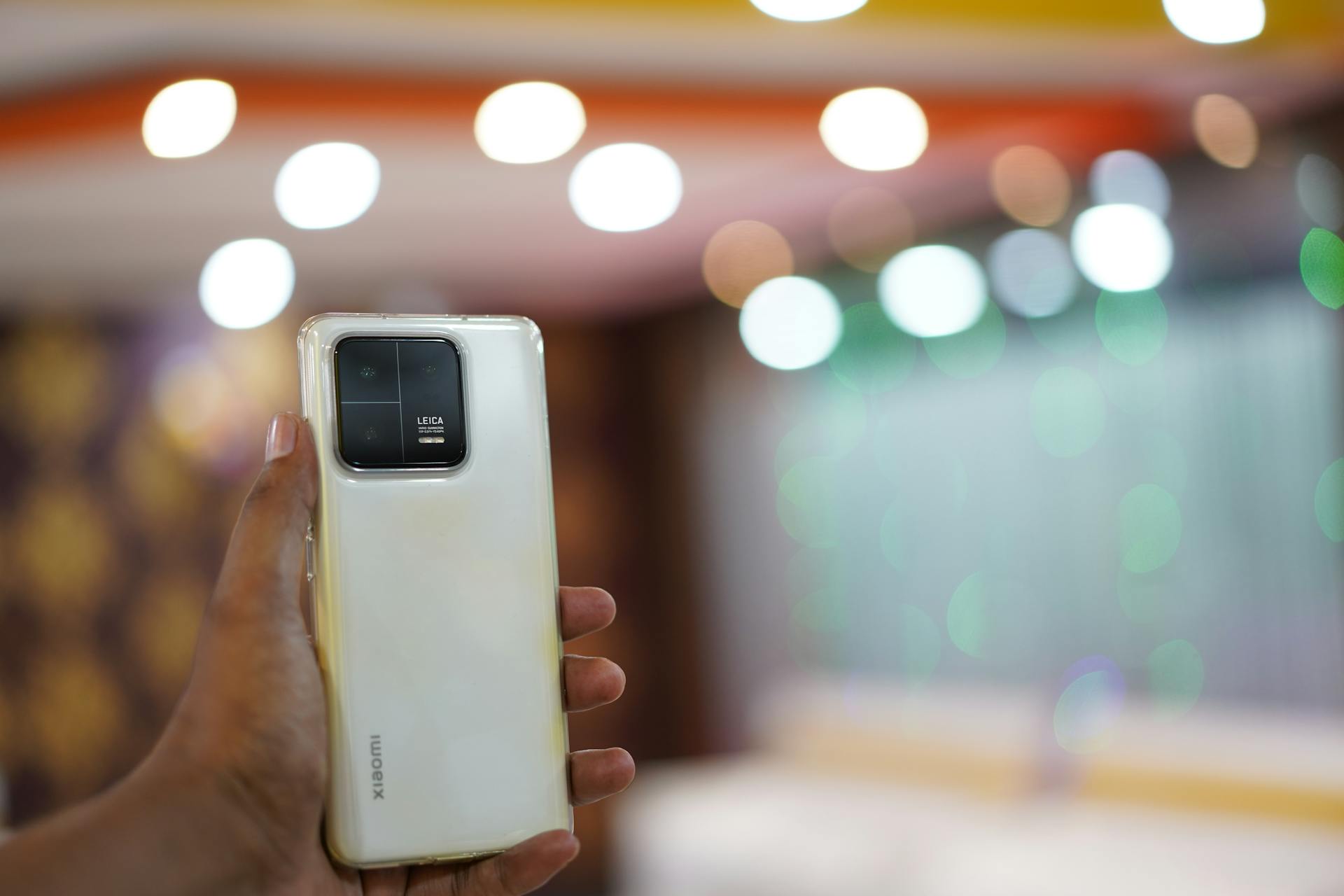 A person holding a smartphone with its cameras facing forward | Source: Pexels