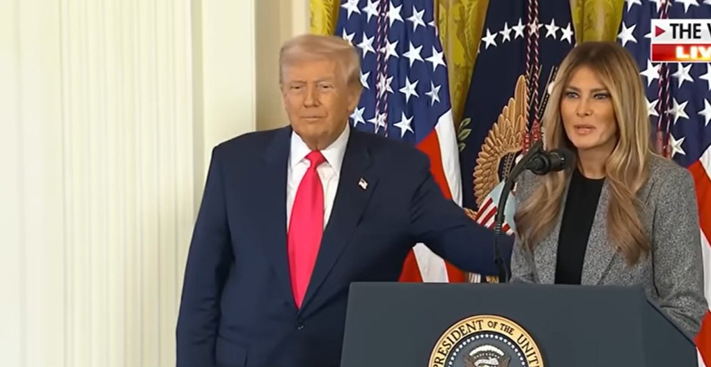 Donald Trump parts Melania's back after her speech during an executive order signing on November 13, 2025 | Source: YouTube/@FoxNews